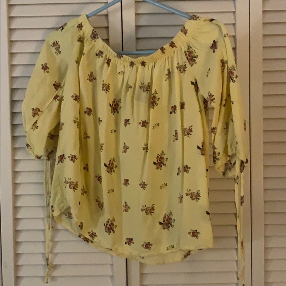 Pale yellow blouse with flower detail